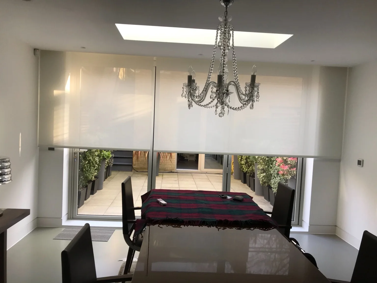 Layered curtains arranged to control light at a bedroom window